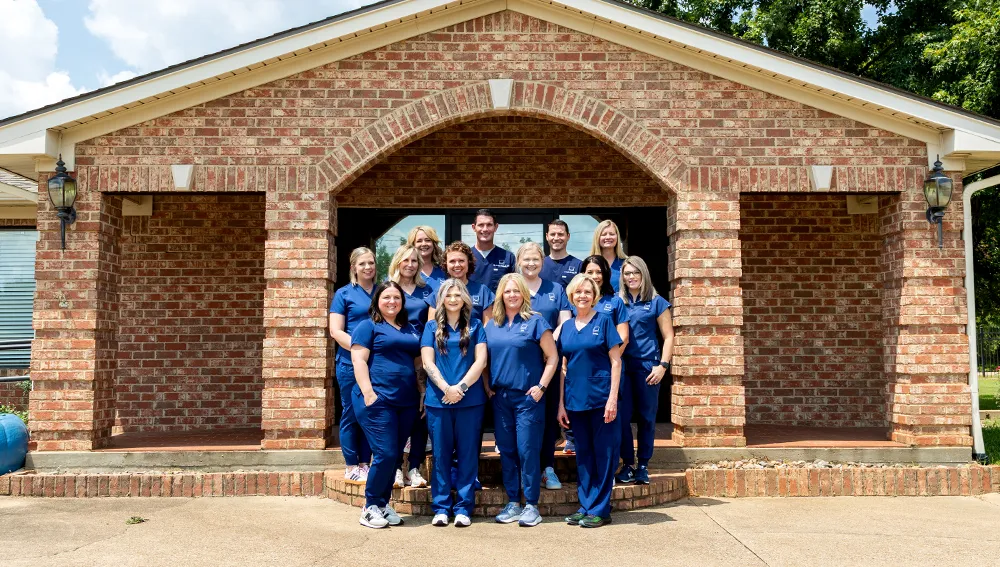 All Smiles Jacksonville team is all smiles with round sunglasses on