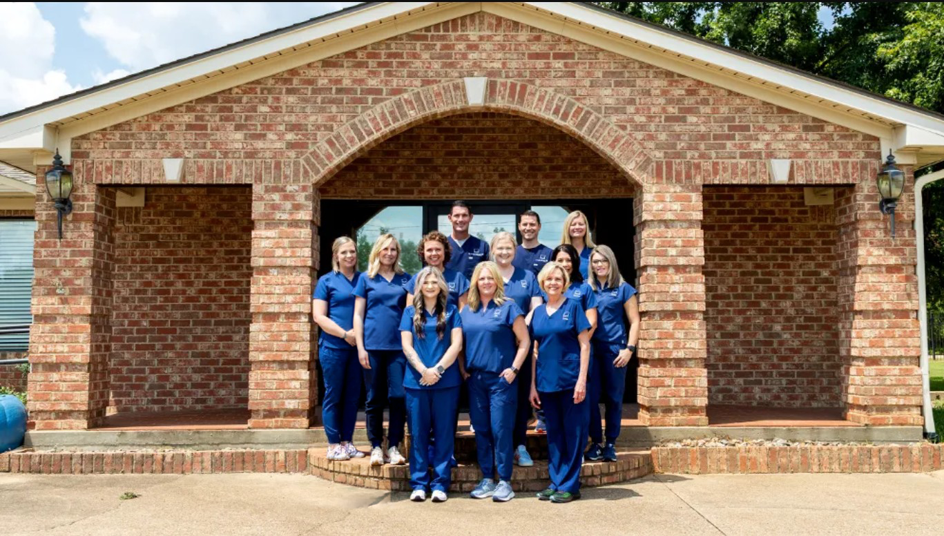All Smiles Jacksonville team is all smiles with round sunglasses on